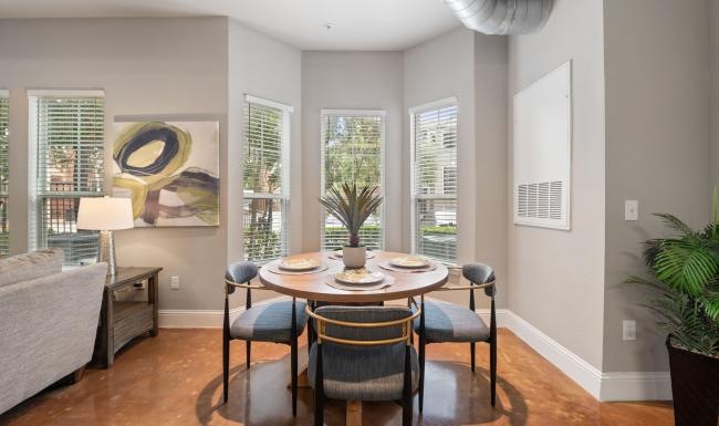 a dining room with a table and chairs