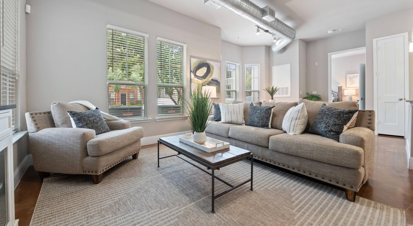 a living room with a couch and coffee table